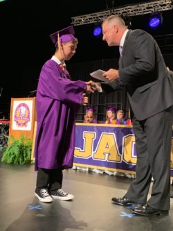 Lisa Parramore's son Adam receiving his high school diploma at his graduation