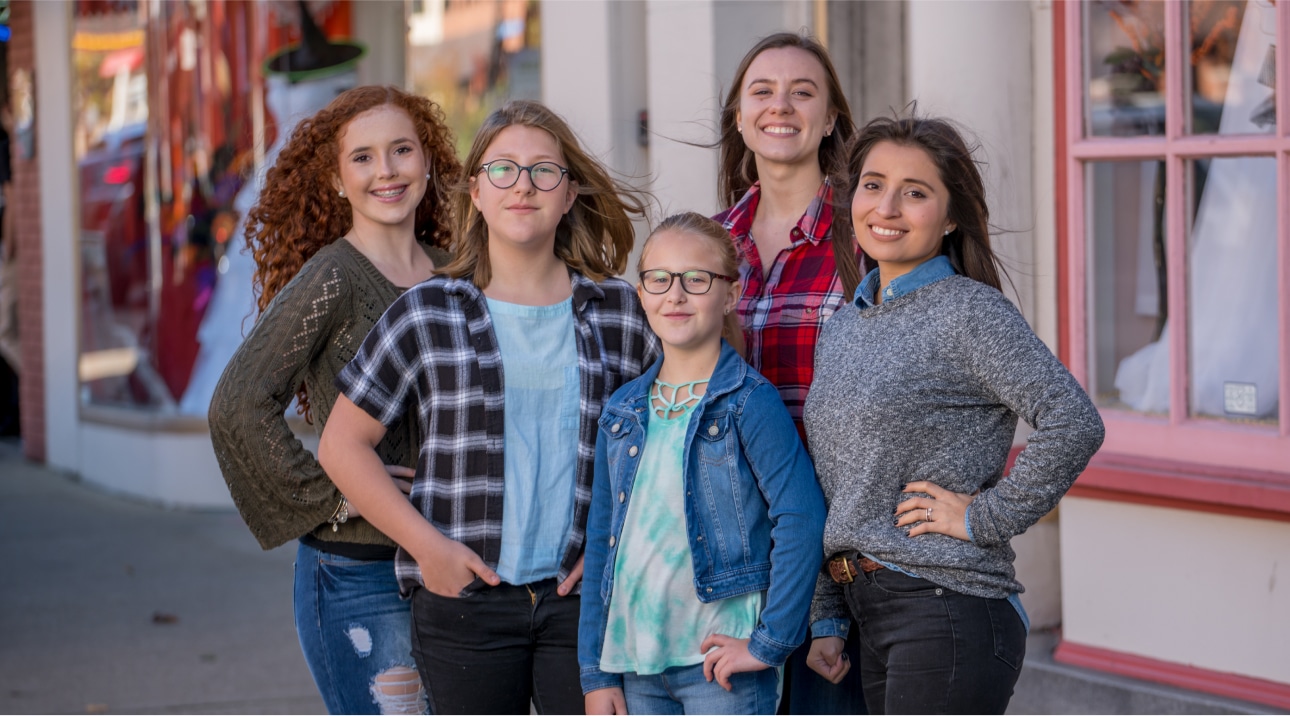 Group of teens outside a shop