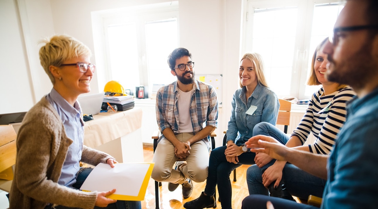 People attending a substance use group counseling meeting