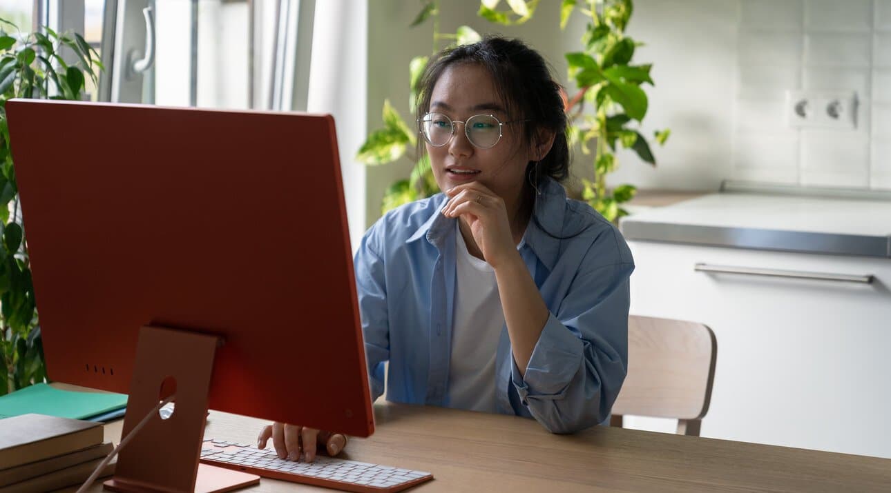 Asian woman reviewing Stark Help Central Resources online